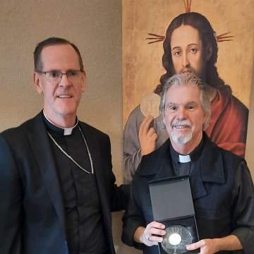 20241019 131535 NPM 4 Fall Meeting Awards phtg Carman Timmerman Msgr Michael Woster, for Fr Dan Juelfs (d 2024-09), St Cecilia (Clergy)