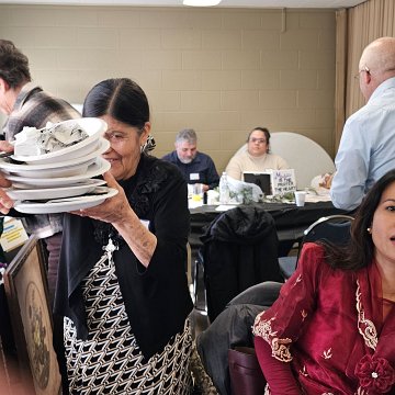 20260131 130936 lunch cleanup LR Maria Muñoz, Vinh Hull NPM Winter Meeting St Isaac Jogues,RC,SD phtg MCN